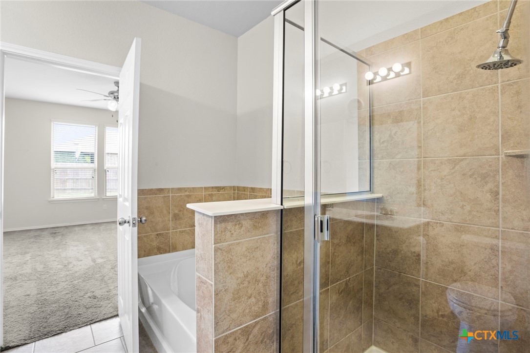 1203 Daffodil Drive Temple, TX 76502 - Photo 24 of 30 a bathroom with a glass shower door