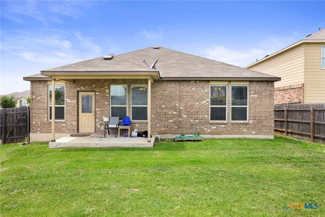1203 Daffodil Drive Temple, TX 76502 - Photo 29 of 30 a view of a house with backyard and porch