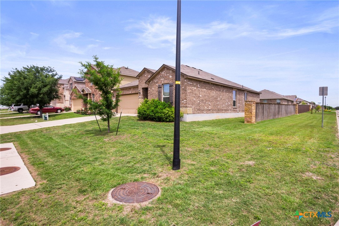 1203 Daffodil Drive Temple, TX 76502 - Photo 5 of 30 a backyard of a house with lots of green space