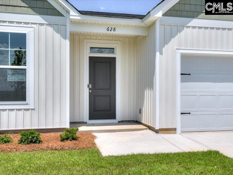 628 Old Charleston Road Pelion, SC 29123 - Photo 4 of 36 a front view of a house with a yard
