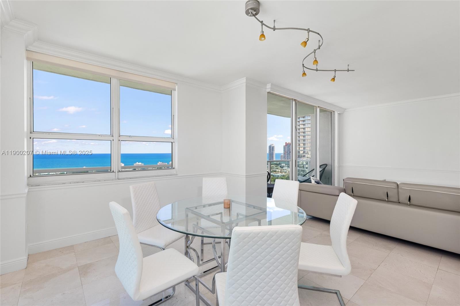650 West Avenue, Unit PH12 Miami Beach, FL 33139 - Photo 16 of 37 a view of a dining room with furniture window and outside view