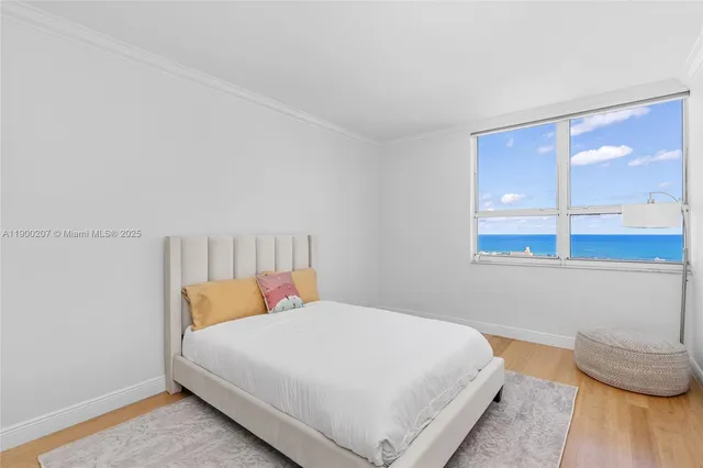 a bedroom with a bed and lamp