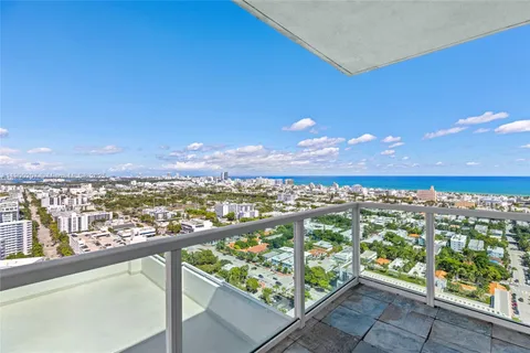a view of a chair and table in balcony