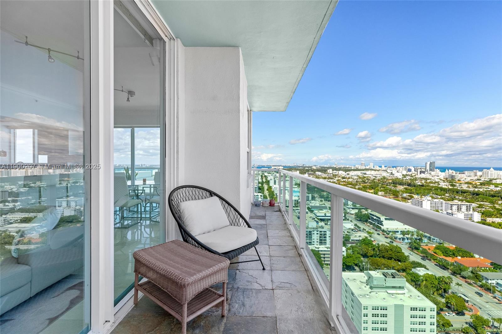 650 West Avenue, Unit PH12 Miami Beach, FL 33139 - Photo 27 of 37 a view of a chair and table in balcony
