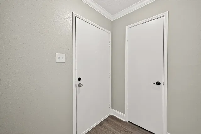 a view of front door with wooden floor