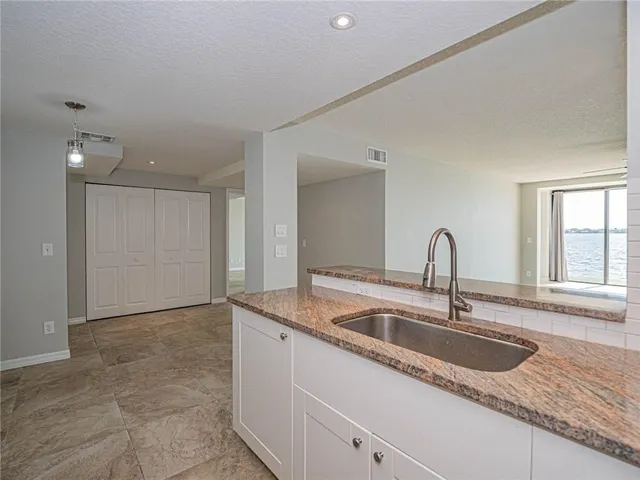a kitchen with granite countertop a sink and a granite counter tops