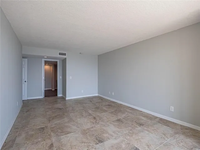 a view of an empty room and window
