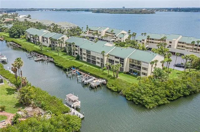 an aerial view of a city with ocean view