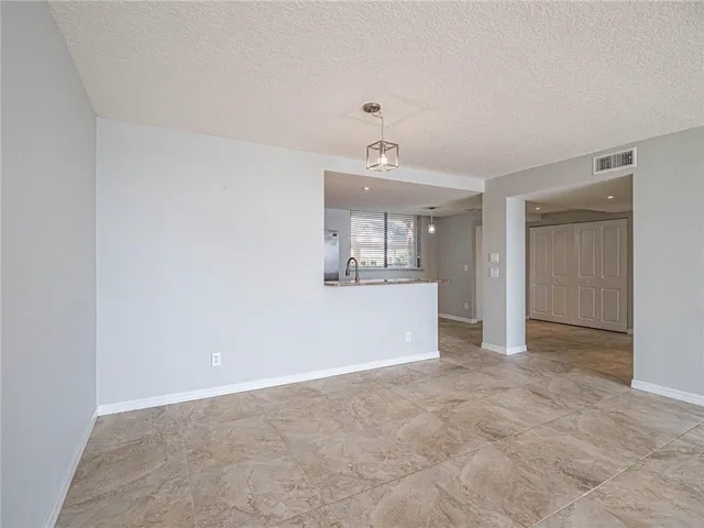 a view of a big room with wooden cabinet and cabinet