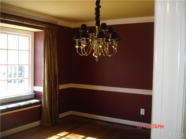 325 Sandhurst Road Raleigh, NC 27615 - Photo 6 of 12 Large Formal Dining Room with Heart of Pine Floors for exquisite dining! Note the smooth ceilings and the detailed moldings/trim throughout this home! Dining Room