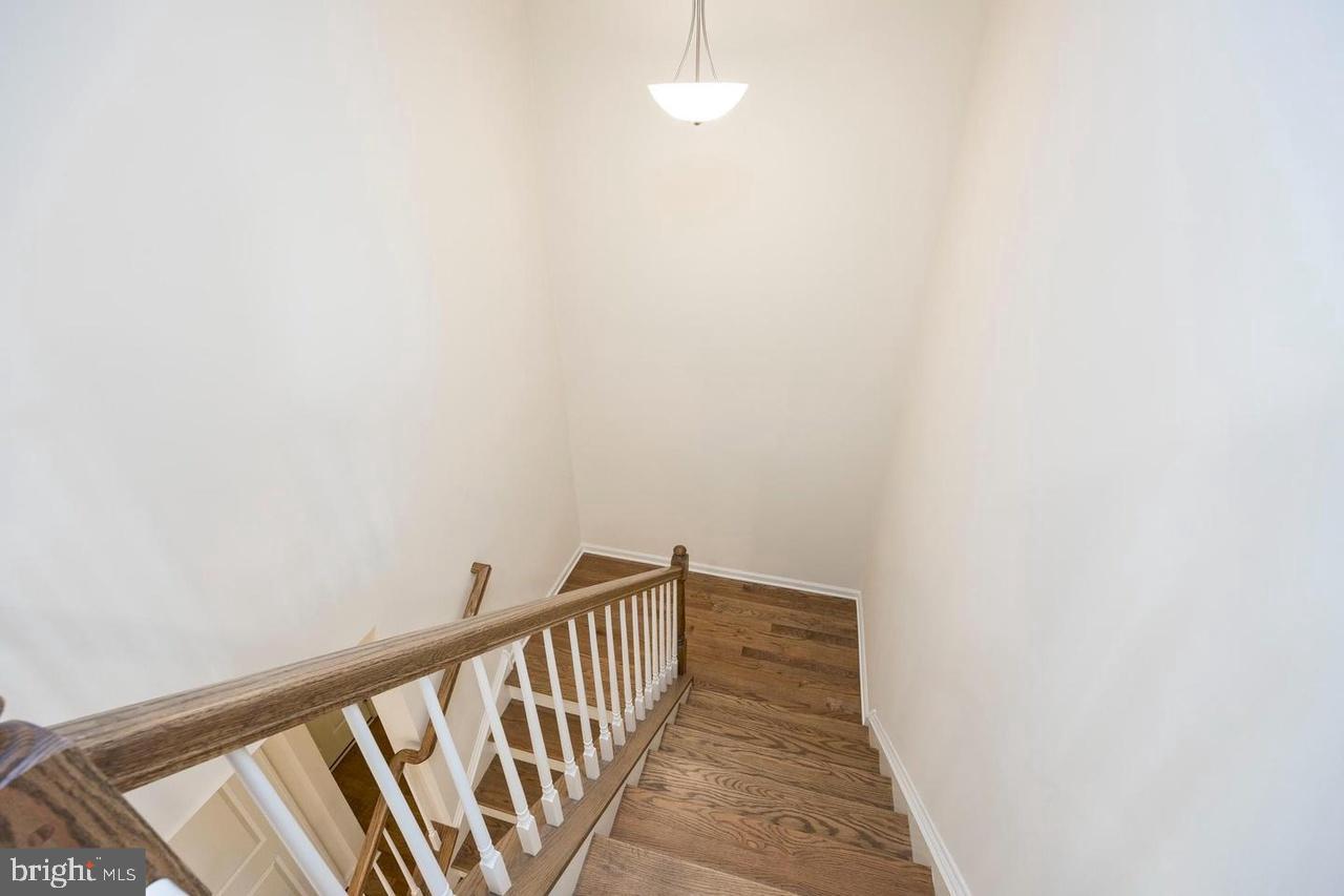 427 Lee Place Exton, PA 19341 - Photo 17 of 33 Inviting staircase with warm wooden accents.