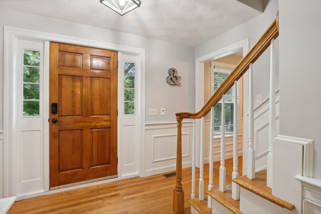 12 Spring Hill Road Merrimac, MA 01860 - Photo 11 of 42 a view of an entryway with wooden floor and door