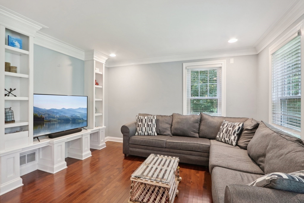 12 Spring Hill Road Merrimac, MA 01860 - Photo 17 of 42 a living room with furniture flat screen tv and wooden floor