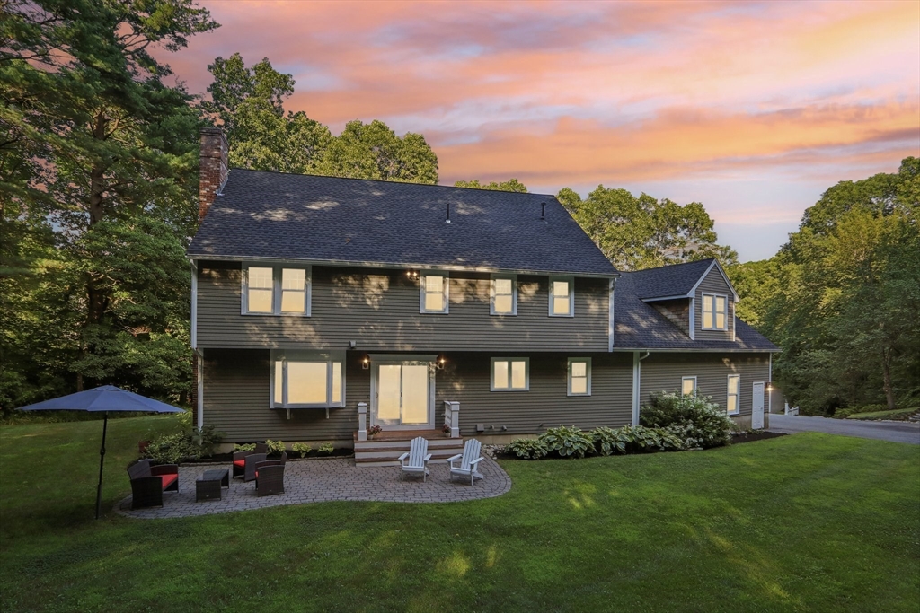 12 Spring Hill Road Merrimac, MA 01860 - Photo 2 of 42 a front view of a house with a garden and plants