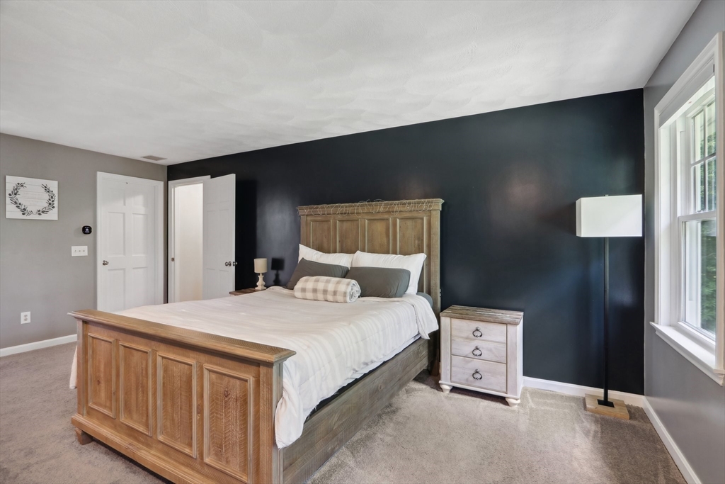 12 Spring Hill Road Merrimac, MA 01860 - Photo 28 of 42 a bedroom with a bed and a window