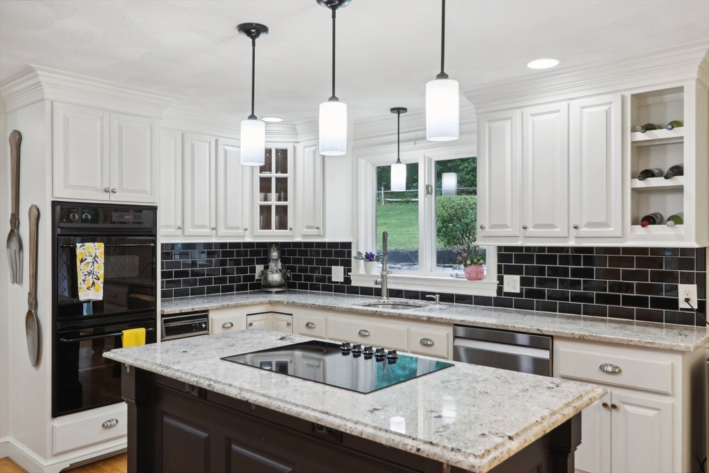 12 Spring Hill Road Merrimac, MA 01860 - Photo 3 of 42 a kitchen that has a sink a oven a counter space and a window