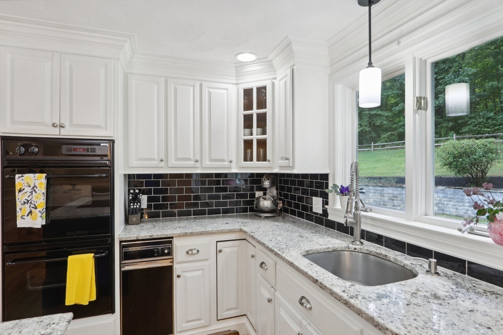 12 Spring Hill Road Merrimac, MA 01860 - Photo 4 of 42 a kitchen that has a sink and a stove