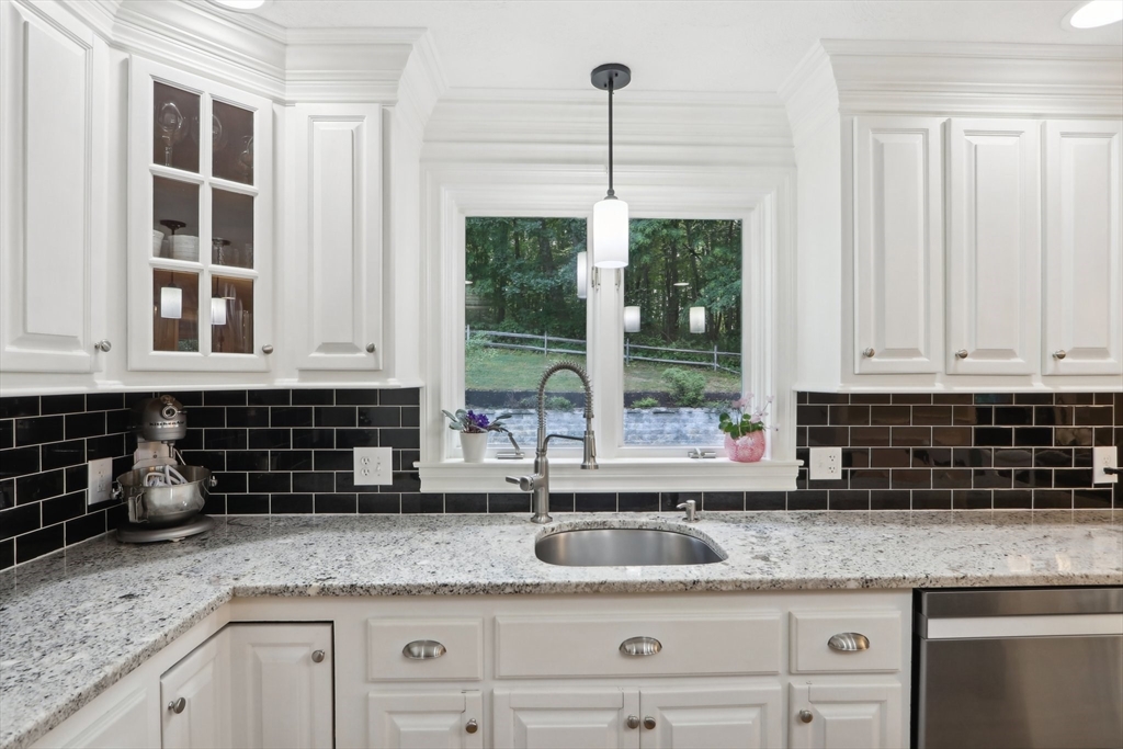 12 Spring Hill Road Merrimac, MA 01860 - Photo 5 of 42 a kitchen with granite countertop a sink and a white wooden floor