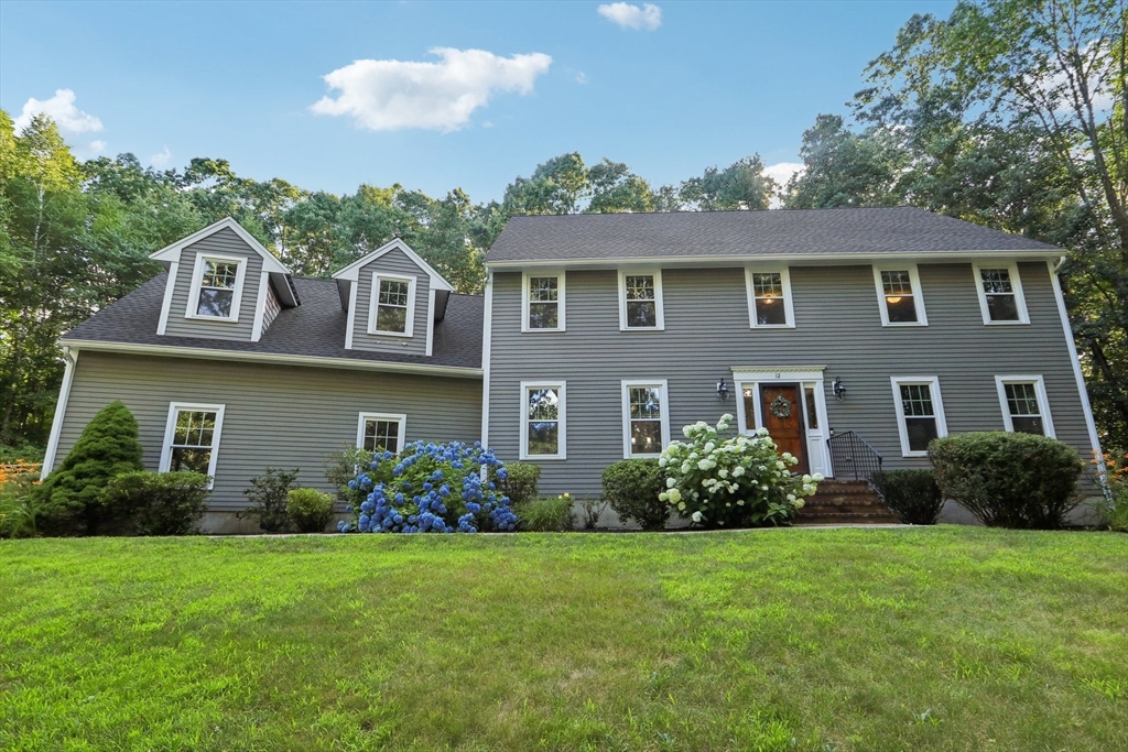 12 Spring Hill Road Merrimac, MA 01860 - Photo 9 of 42 a front view of a house with garden