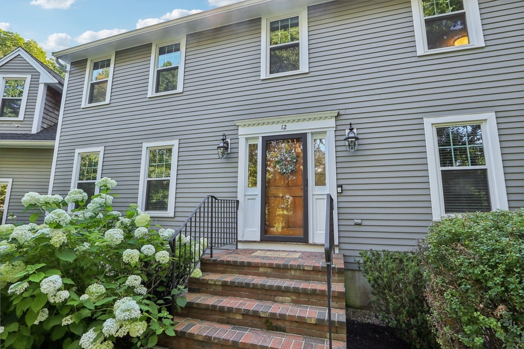 12 Spring Hill Road Merrimac, MA 01860 - Photo 10 of 42 a view of a house with potted plants and a windows