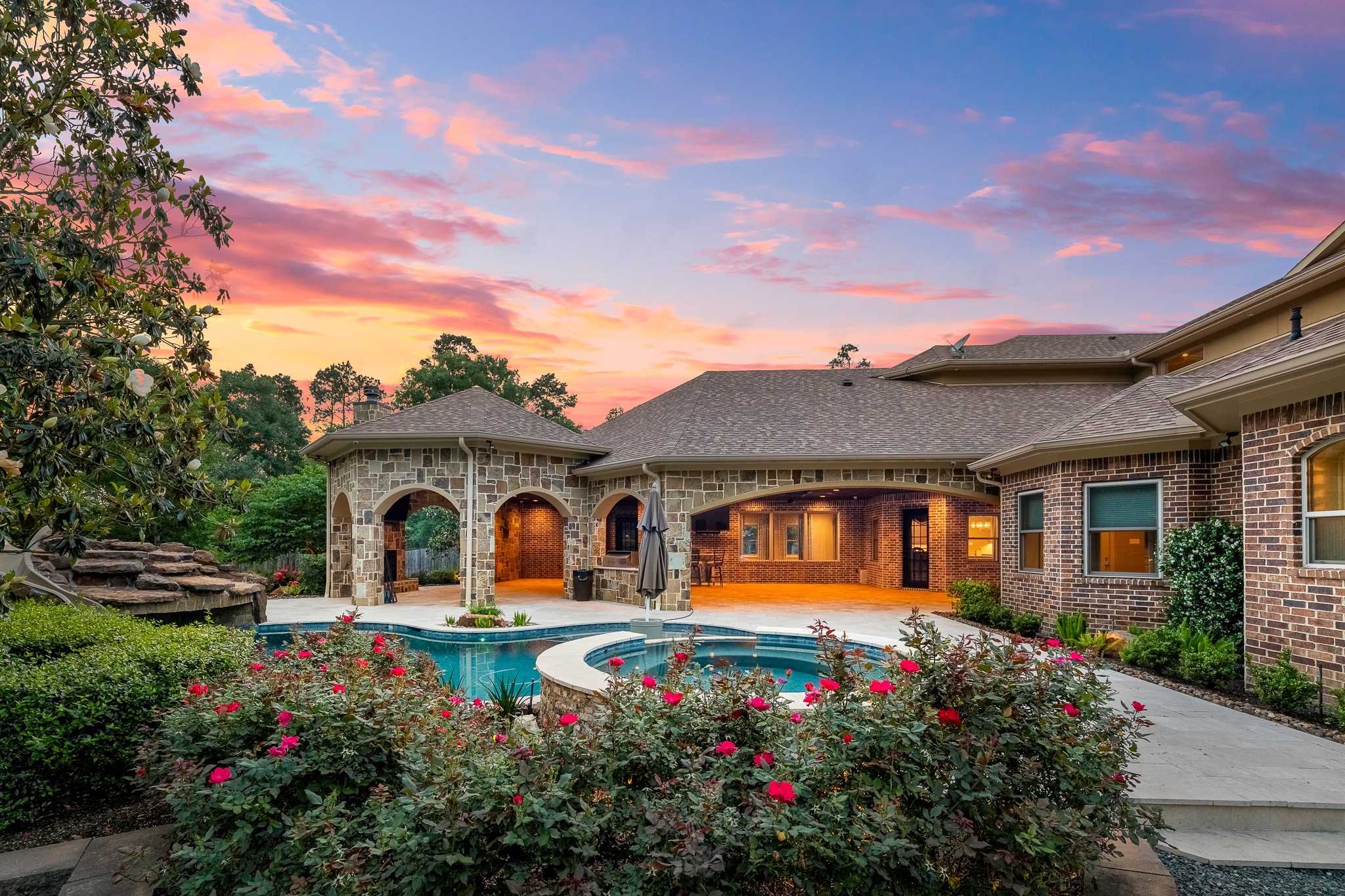 28002 Whispering Maple Way Spring, TX 77386 - Photo 5 of 44 a front view of a house with a garden
