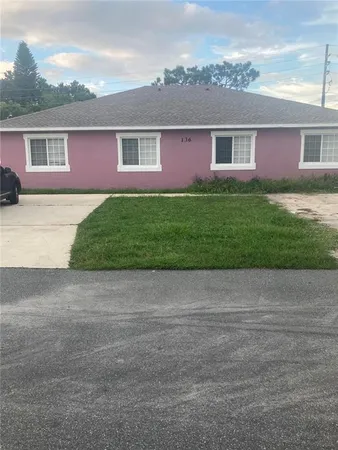 front view of house with a yard