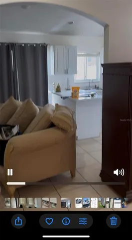 a kitchen with a refrigerator and a stove