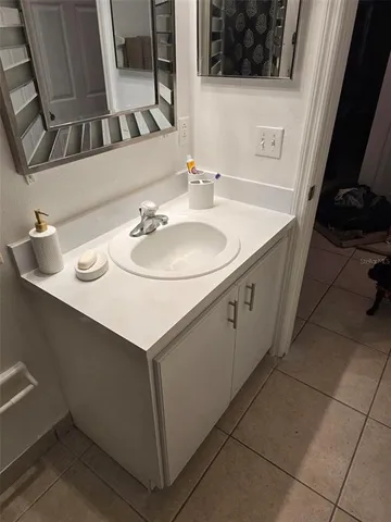 a bathroom with a sink and a mirror