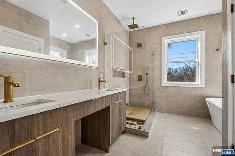 a bathroom with a sink a mirror and a toilet
