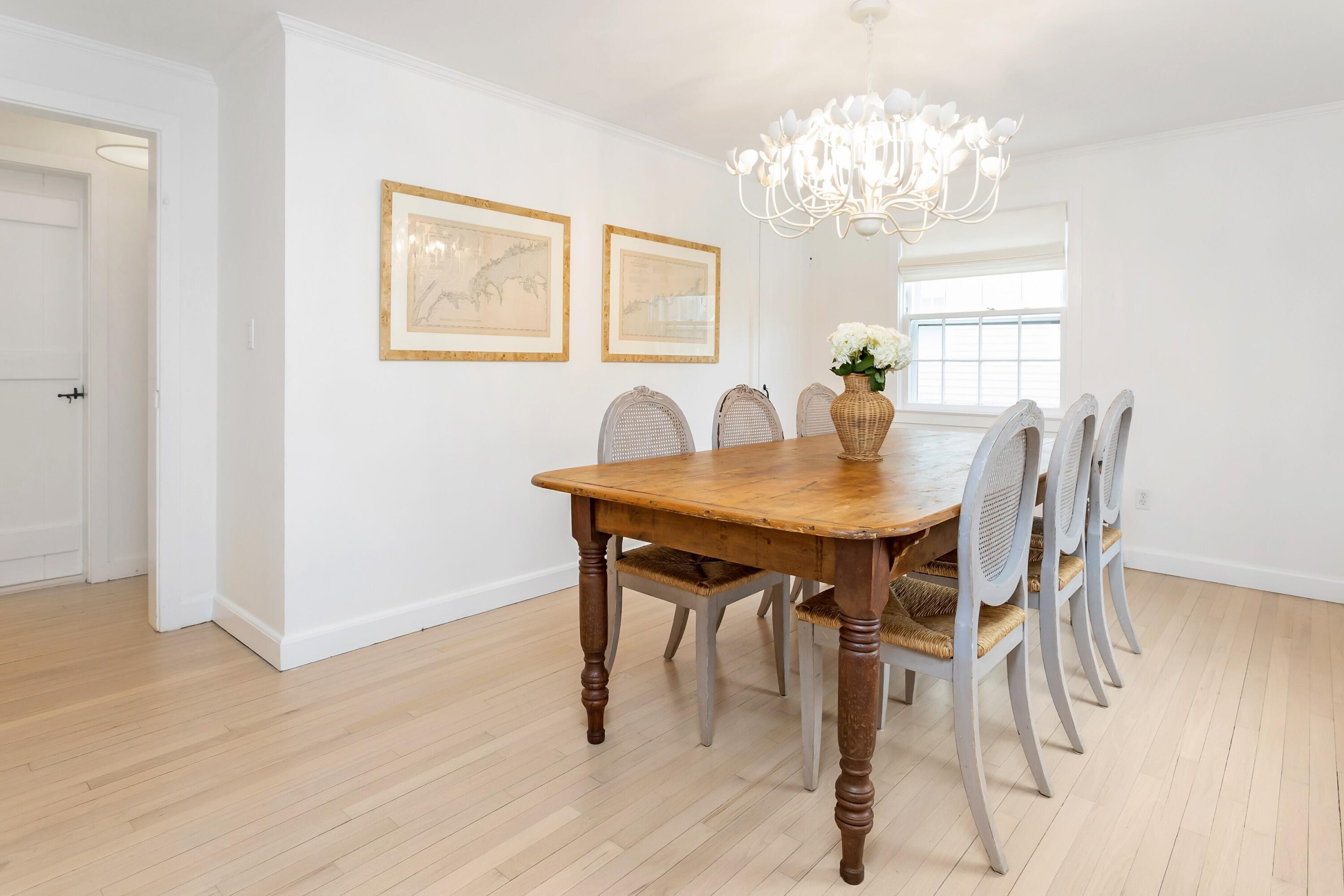 22 Intervale Road Darien, CT 06820 - Photo 13 of 37 a dining room with furniture a chandelier and wooden floor