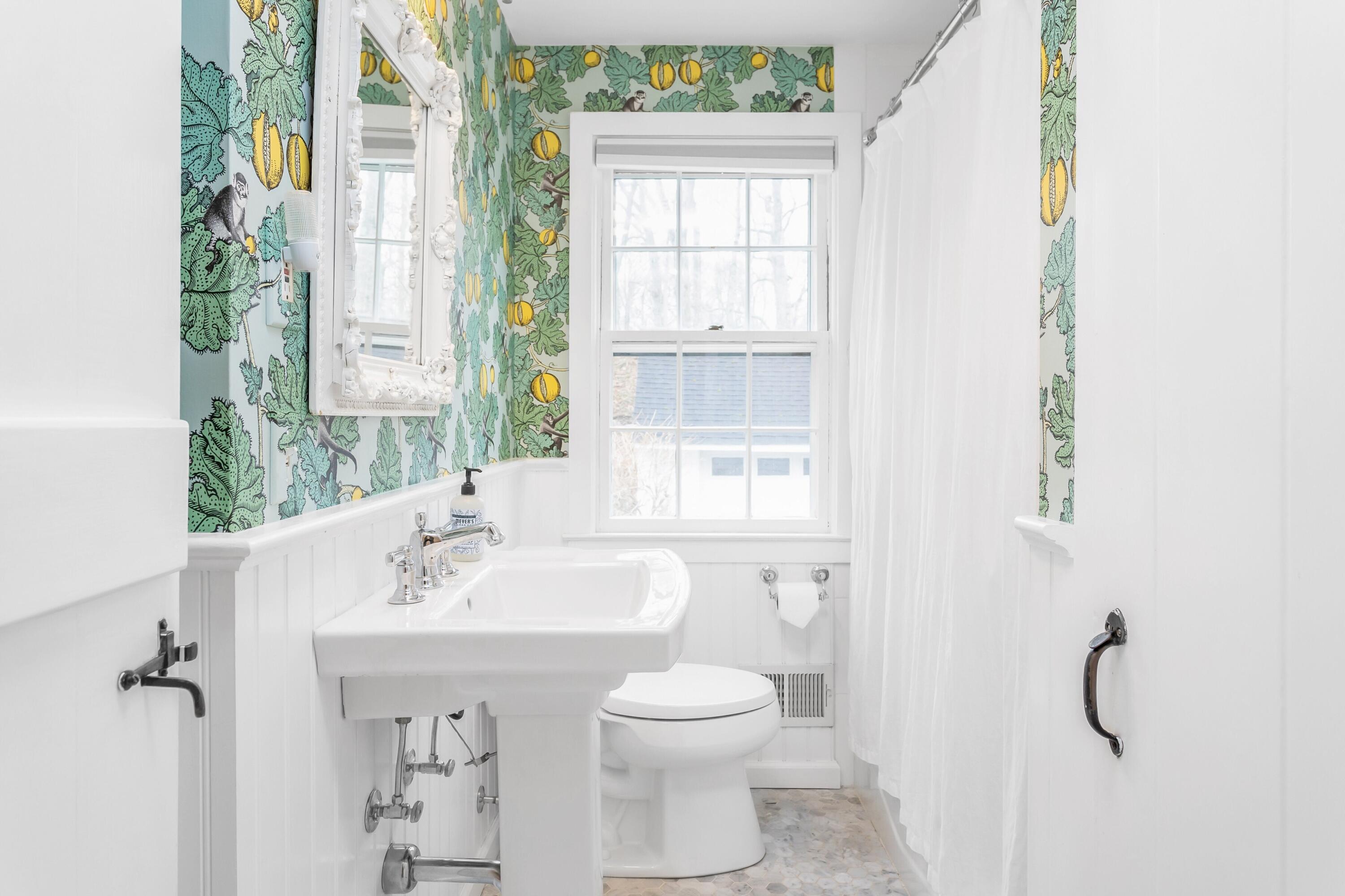 22 Intervale Road Darien, CT 06820 - Photo 16 of 37 a bathroom with a sink a toilet and a window