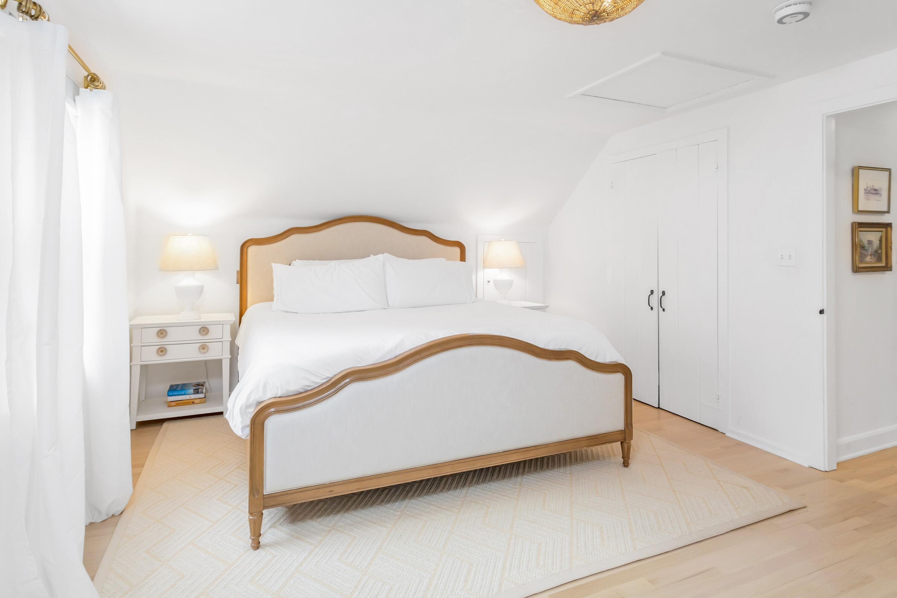 22 Intervale Road Darien, CT 06820 - Photo 17 of 37 a bed sitting in a bedroom next to a bathroom