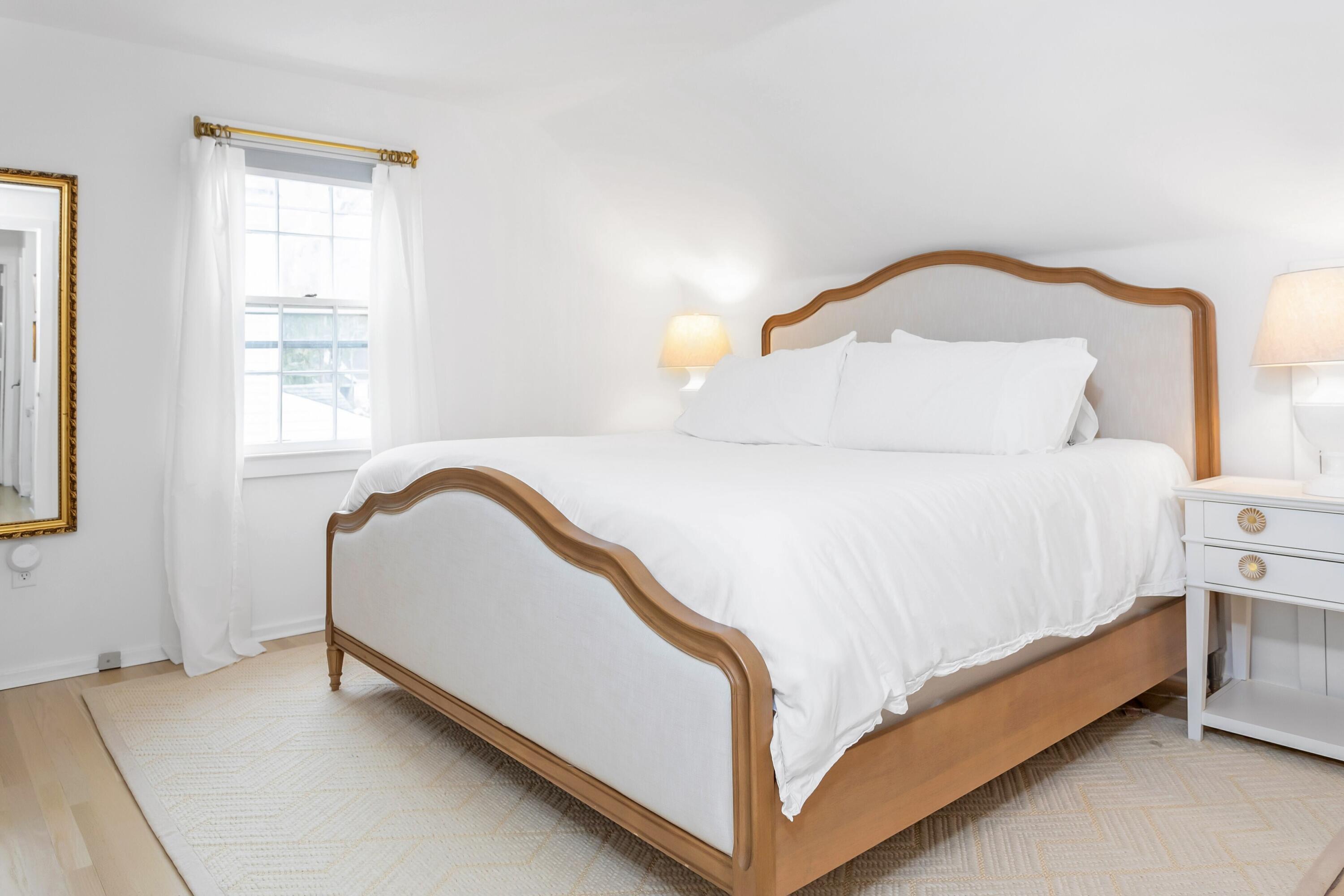 22 Intervale Road Darien, CT 06820 - Photo 18 of 37 a bed sitting in a bedroom next to a window
