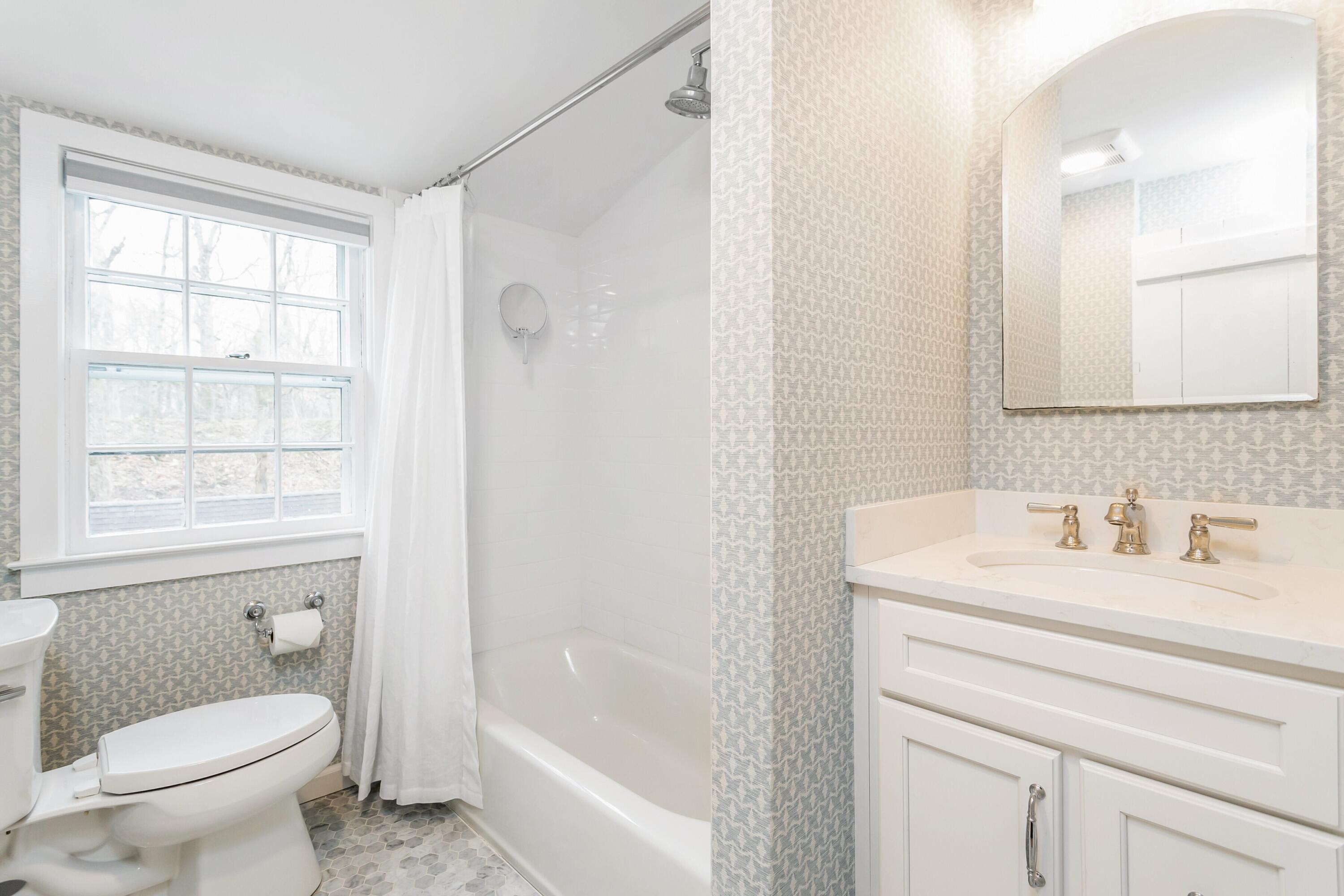 22 Intervale Road Darien, CT 06820 - Photo 22 of 37 a bathroom with a sink a toilet and shower