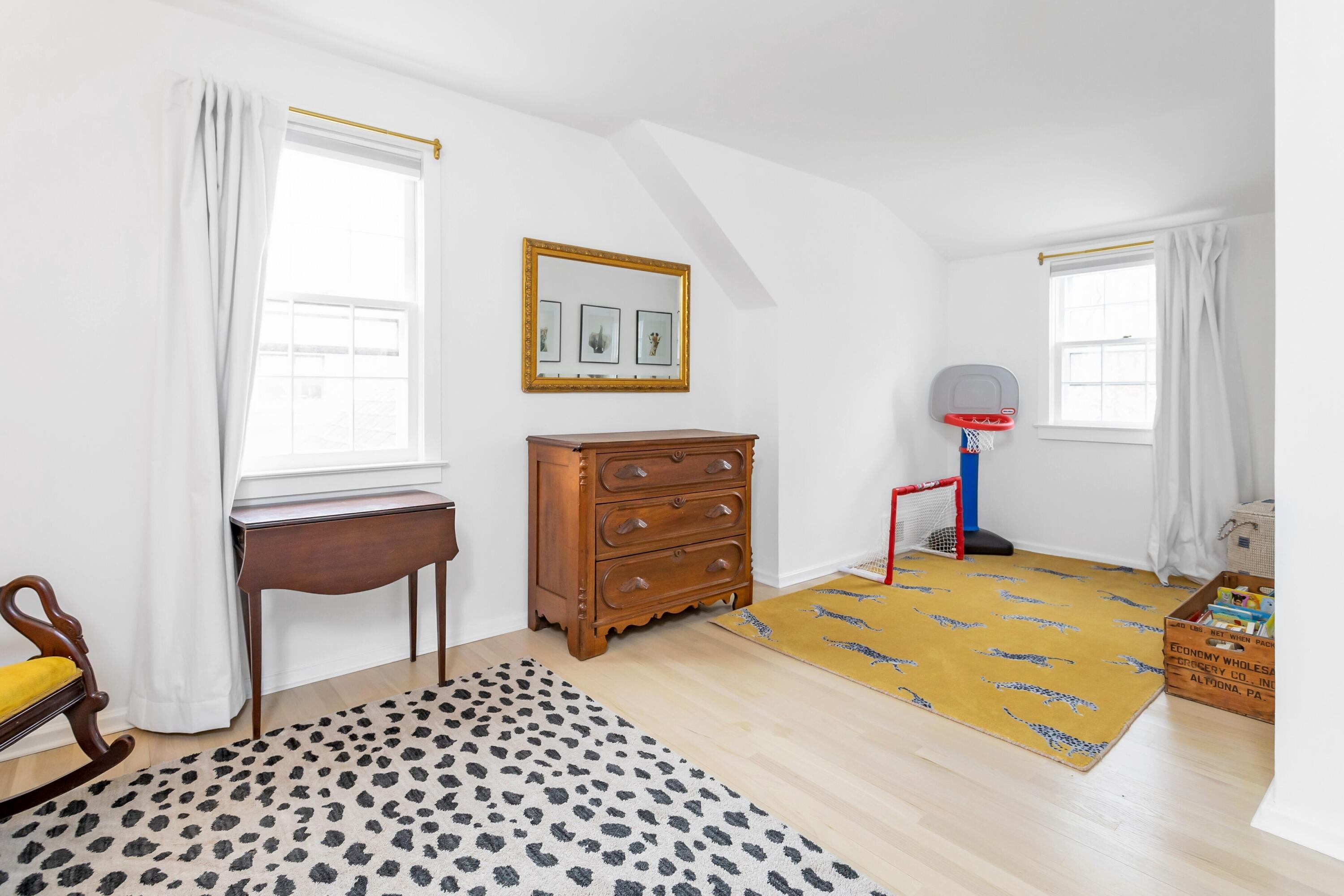 22 Intervale Road Darien, CT 06820 - Photo 24 of 37 a bedroom with a bed and a chair