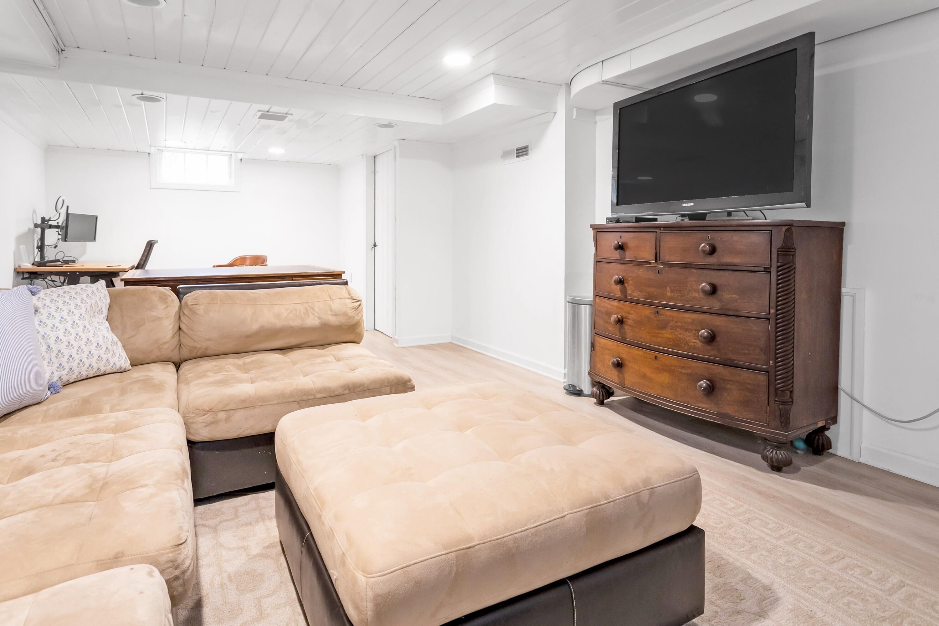 22 Intervale Road Darien, CT 06820 - Photo 27 of 37 a bedroom with a bed and a flat screen tv