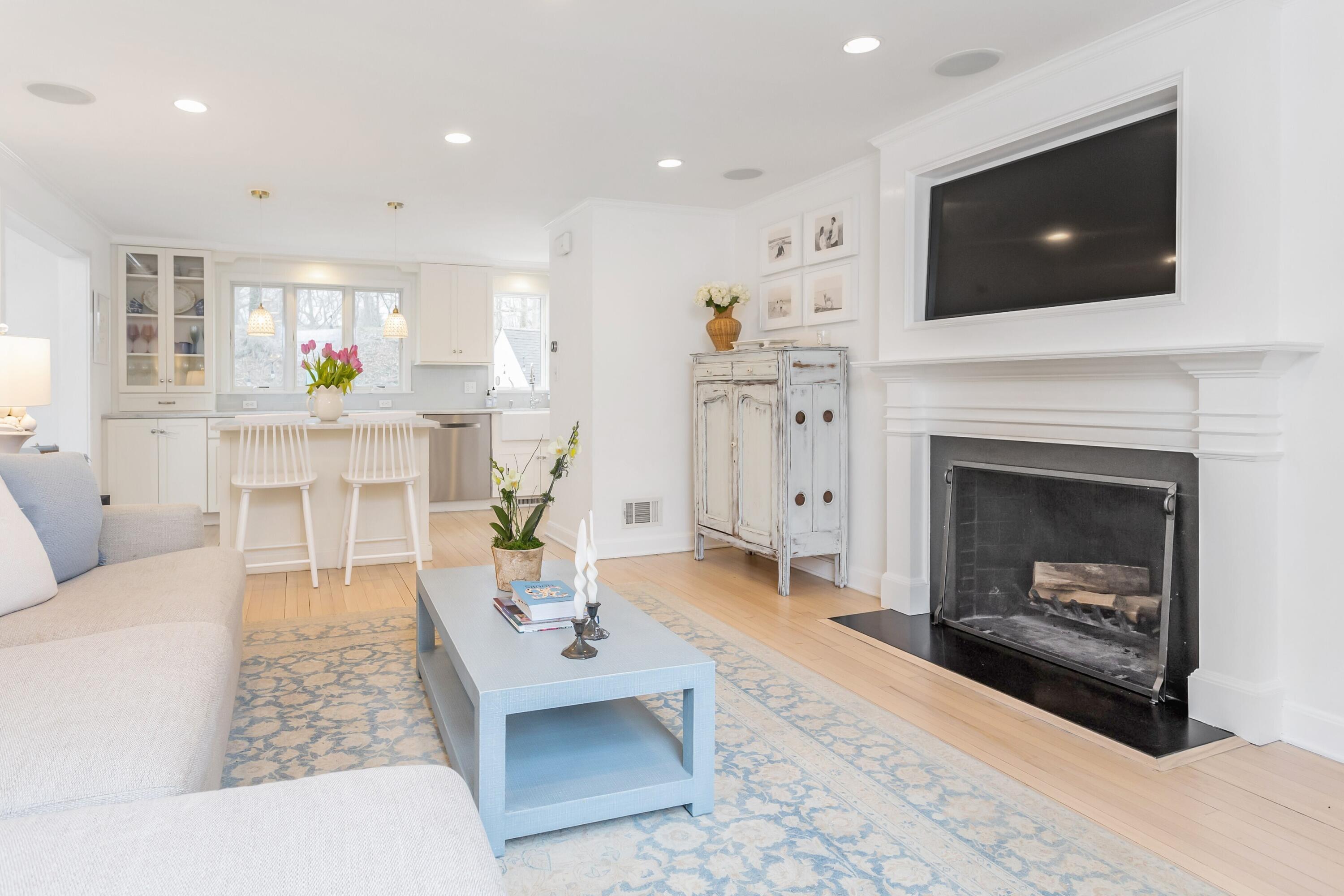 22 Intervale Road Darien, CT 06820 - Photo 4 of 37 a living room with furniture a fireplace and a flat screen tv