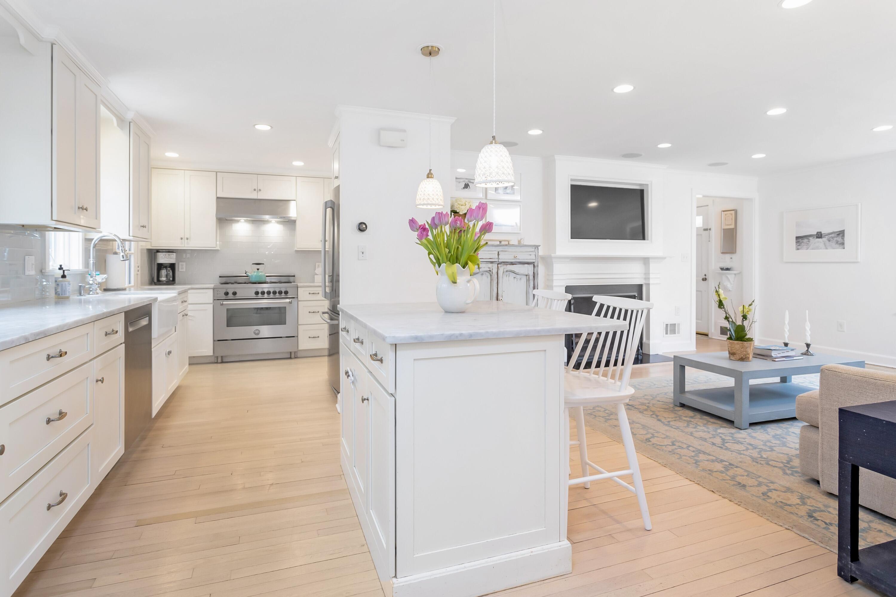22 Intervale Road Darien, CT 06820 - Photo 8 of 37 a kitchen with white cabinets and stainless steel appliances