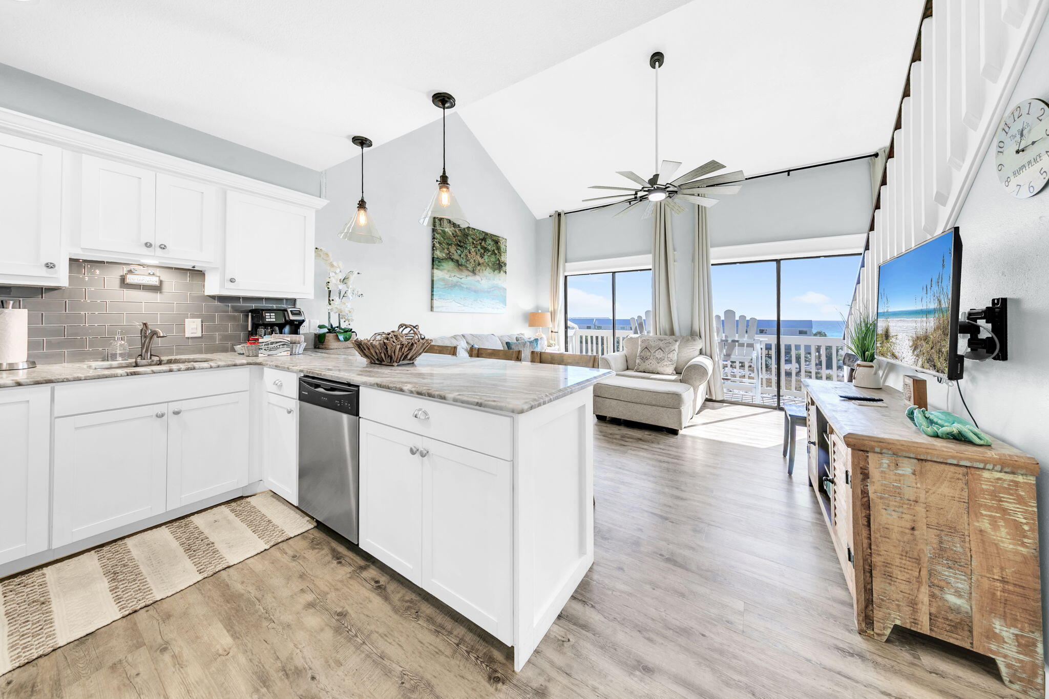 145 Beachfront Trail, Unit 307A Santa Rosa Beach, FL 32459 - Photo 13 of 60 a kitchen with a sink stove cabinets and wooden floor