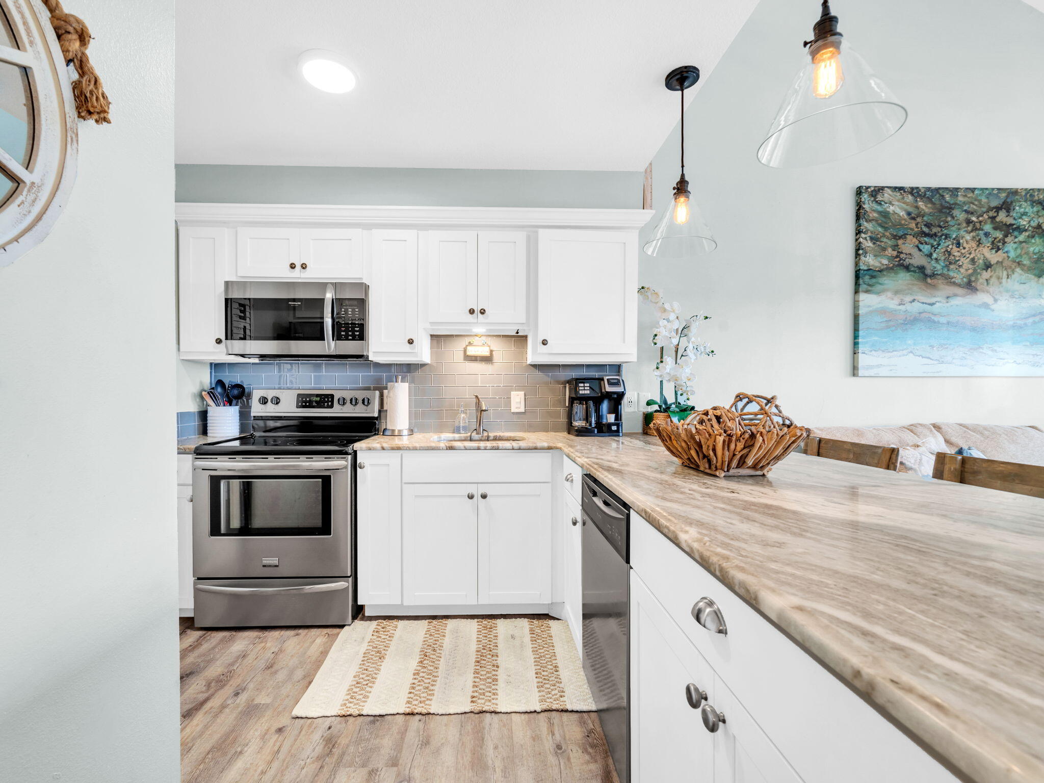 145 Beachfront Trail, Unit 307A Santa Rosa Beach, FL 32459 - Photo 14 of 60 a kitchen with a sink stove and microwave