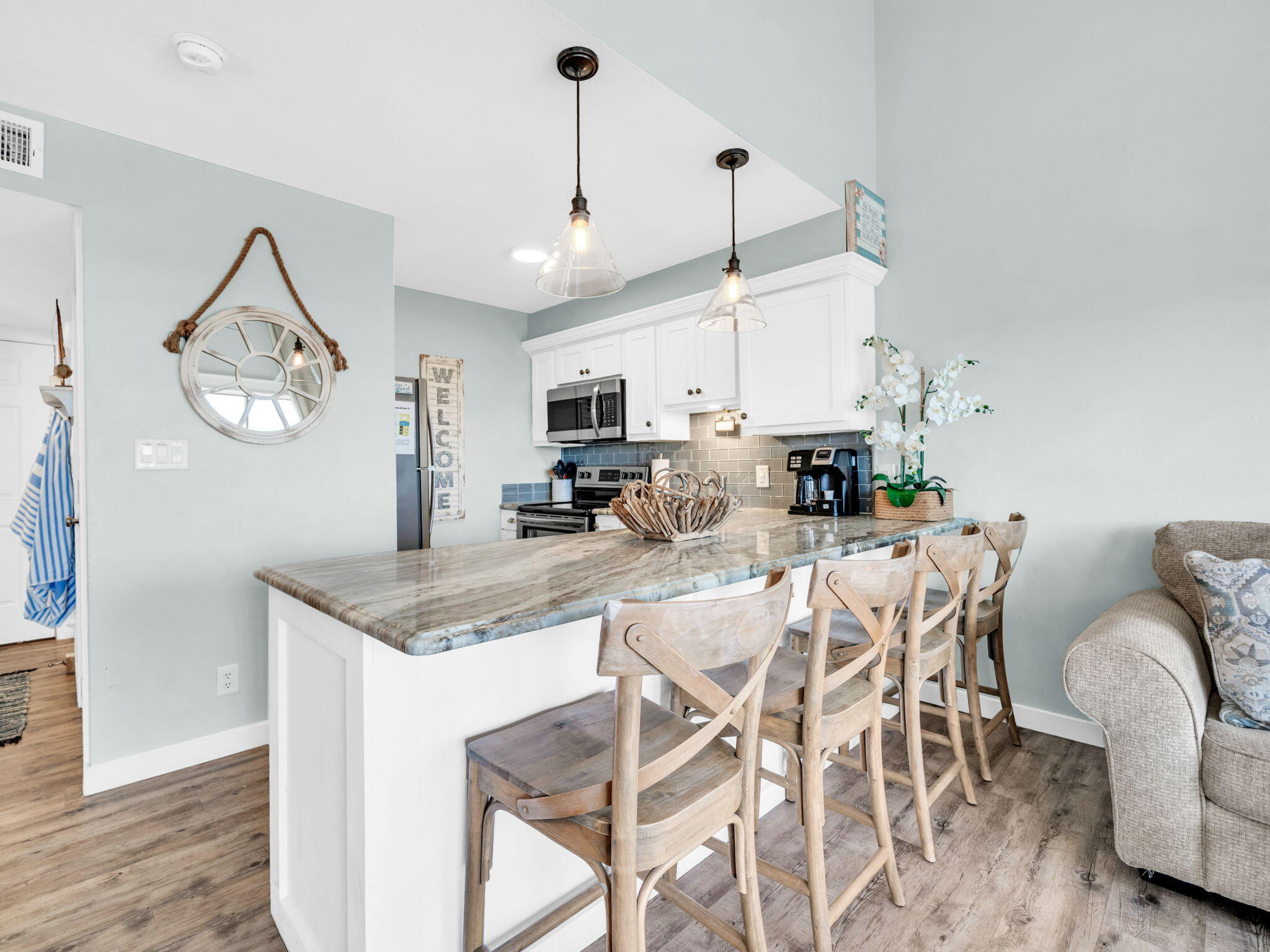 145 Beachfront Trail, Unit 307A Santa Rosa Beach, FL 32459 - Photo 18 of 60 a kitchen with stainless steel appliances granite countertop a sink a stove and a refrigerator