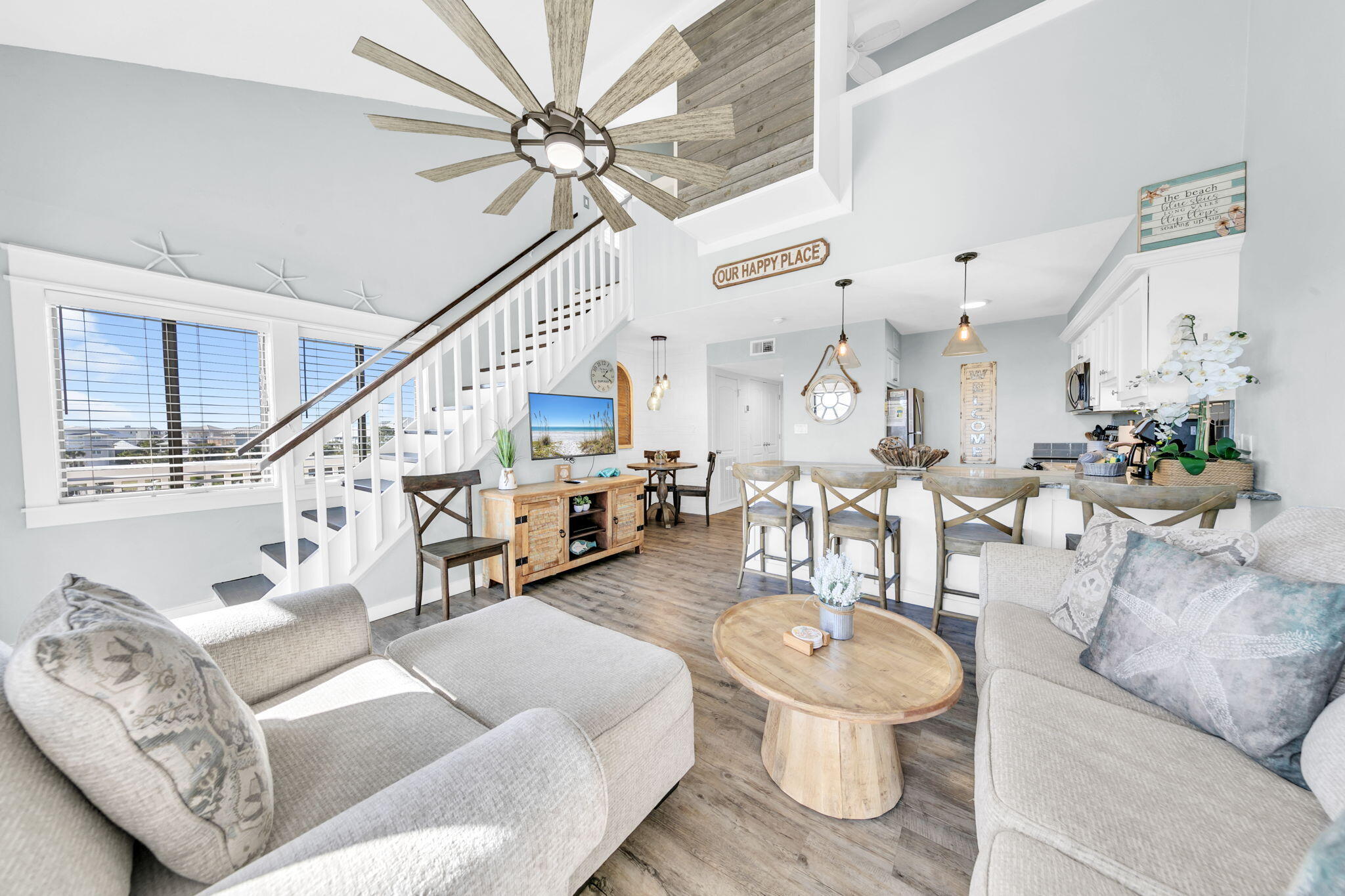 145 Beachfront Trail, Unit 307A Santa Rosa Beach, FL 32459 - Photo 22 of 60 a living room with furniture and a chandelier