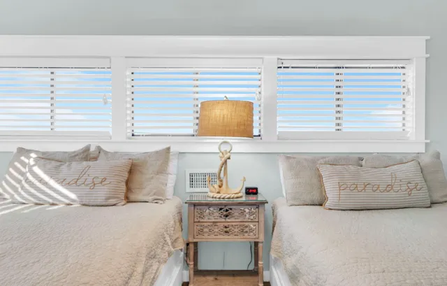 a view of a swimming pool and an outdoor seating