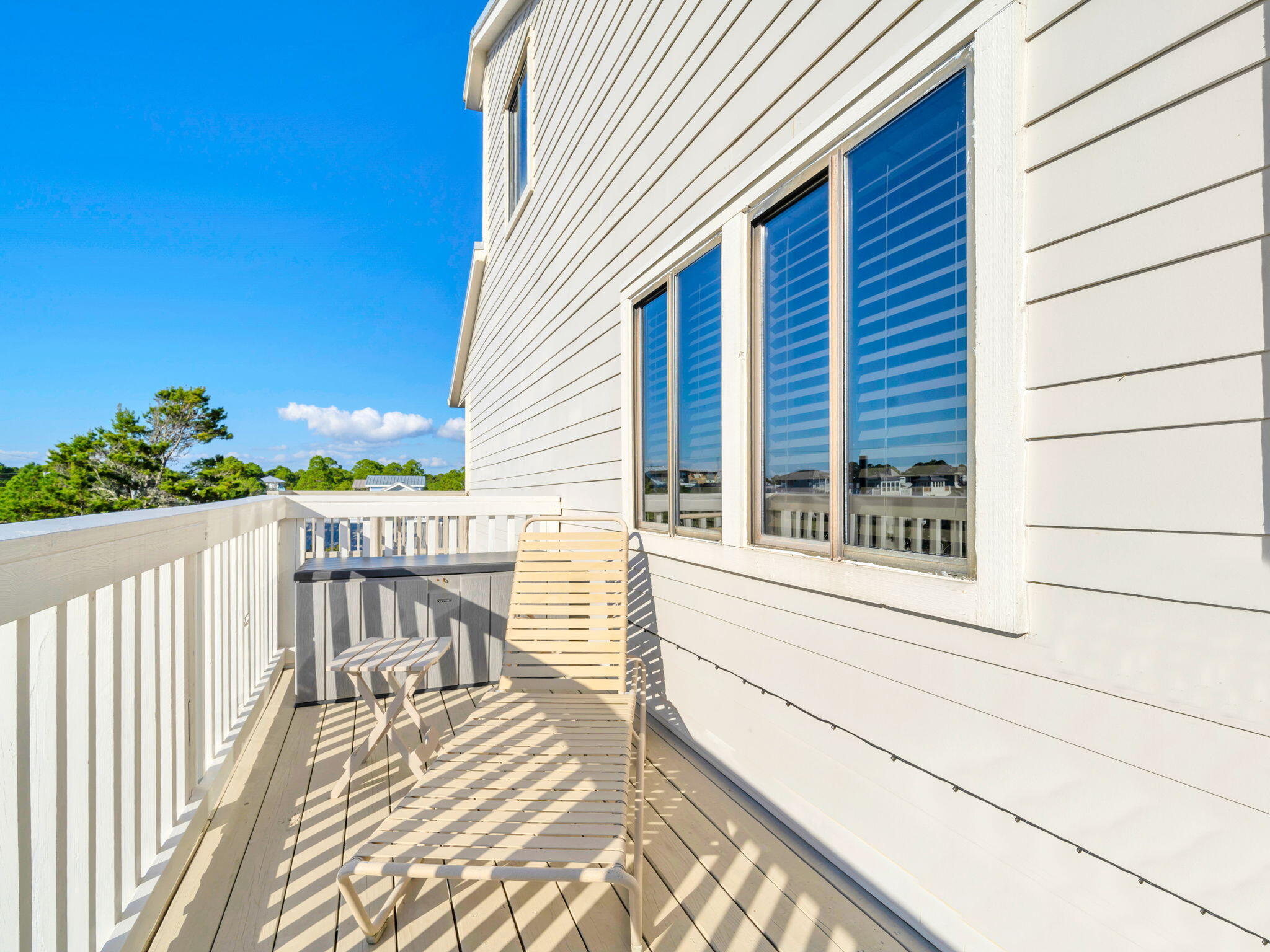 145 Beachfront Trail, Unit 307A Santa Rosa Beach, FL 32459 - Photo 32 of 60 a view of a balcony with wooden floor and fence