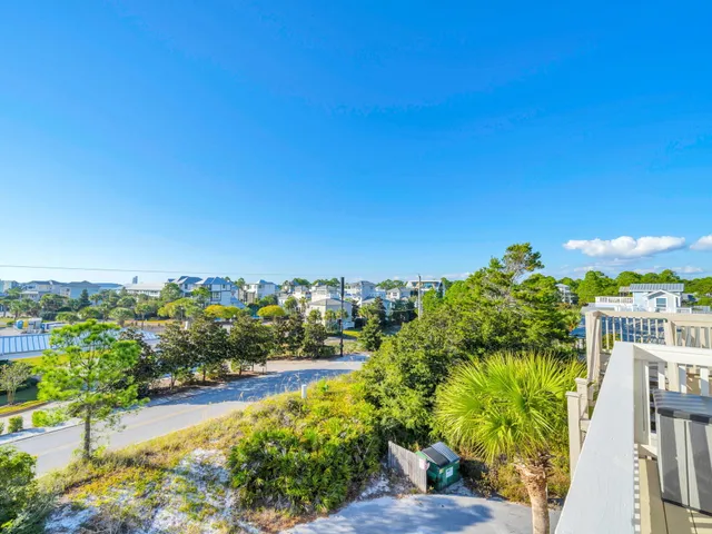 a view of a patio with a table and chairs
