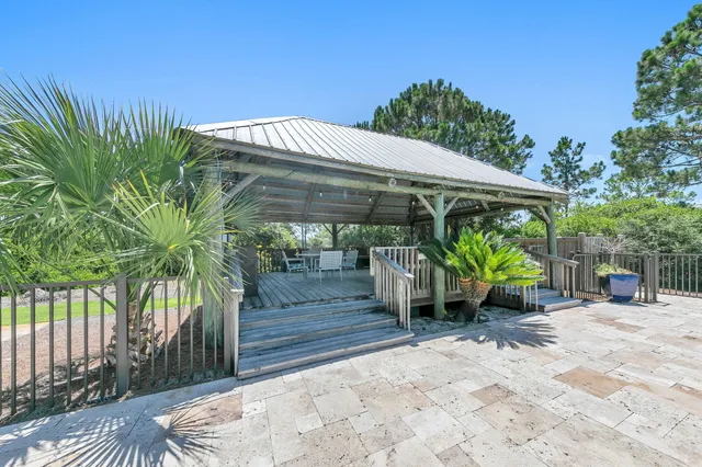 a swimming pool with outdoor seating and deck