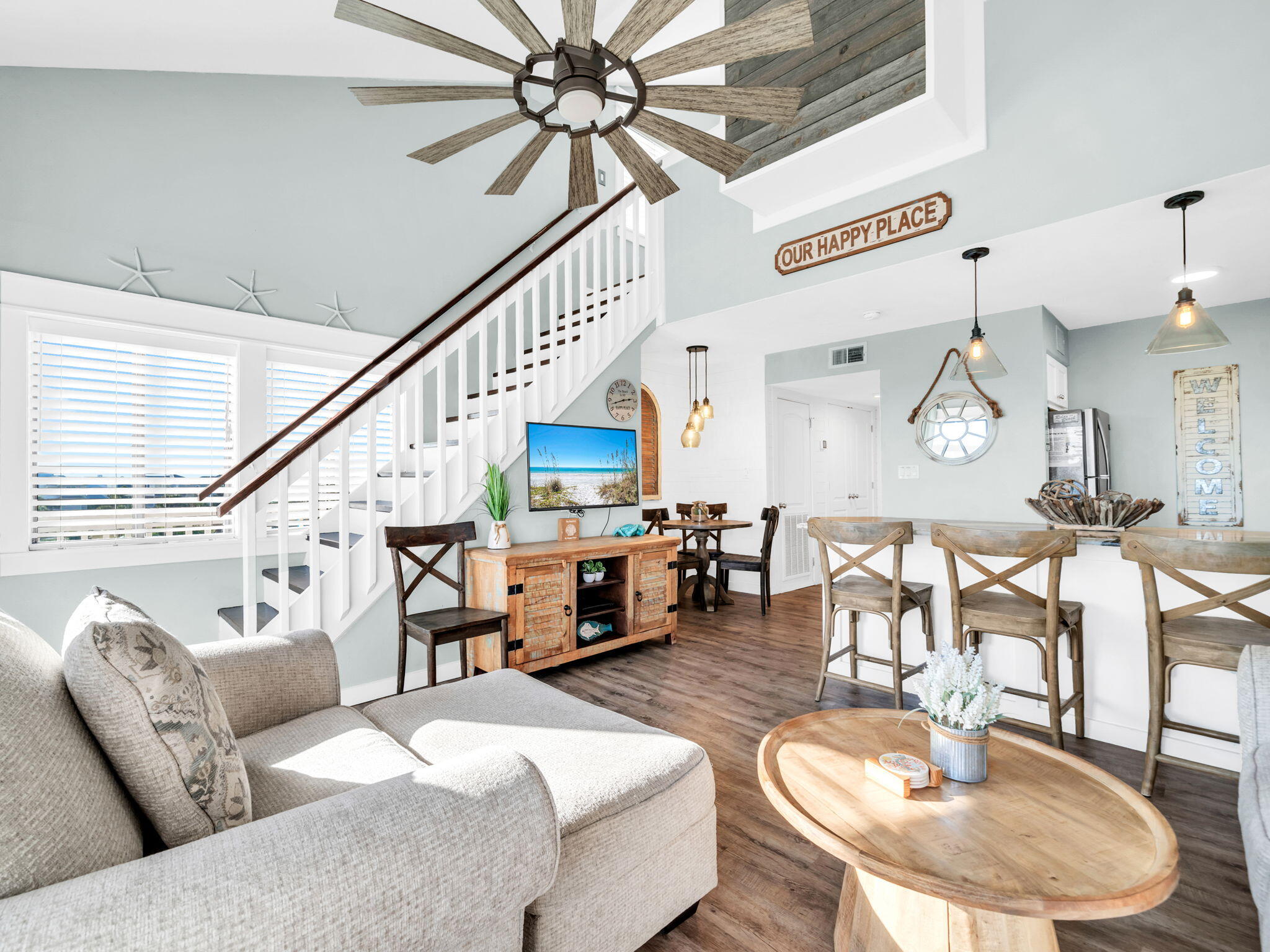 145 Beachfront Trail, Unit 307A Santa Rosa Beach, FL 32459 - Photo 4 of 60 a living room with furniture kitchen view and a wooden floor