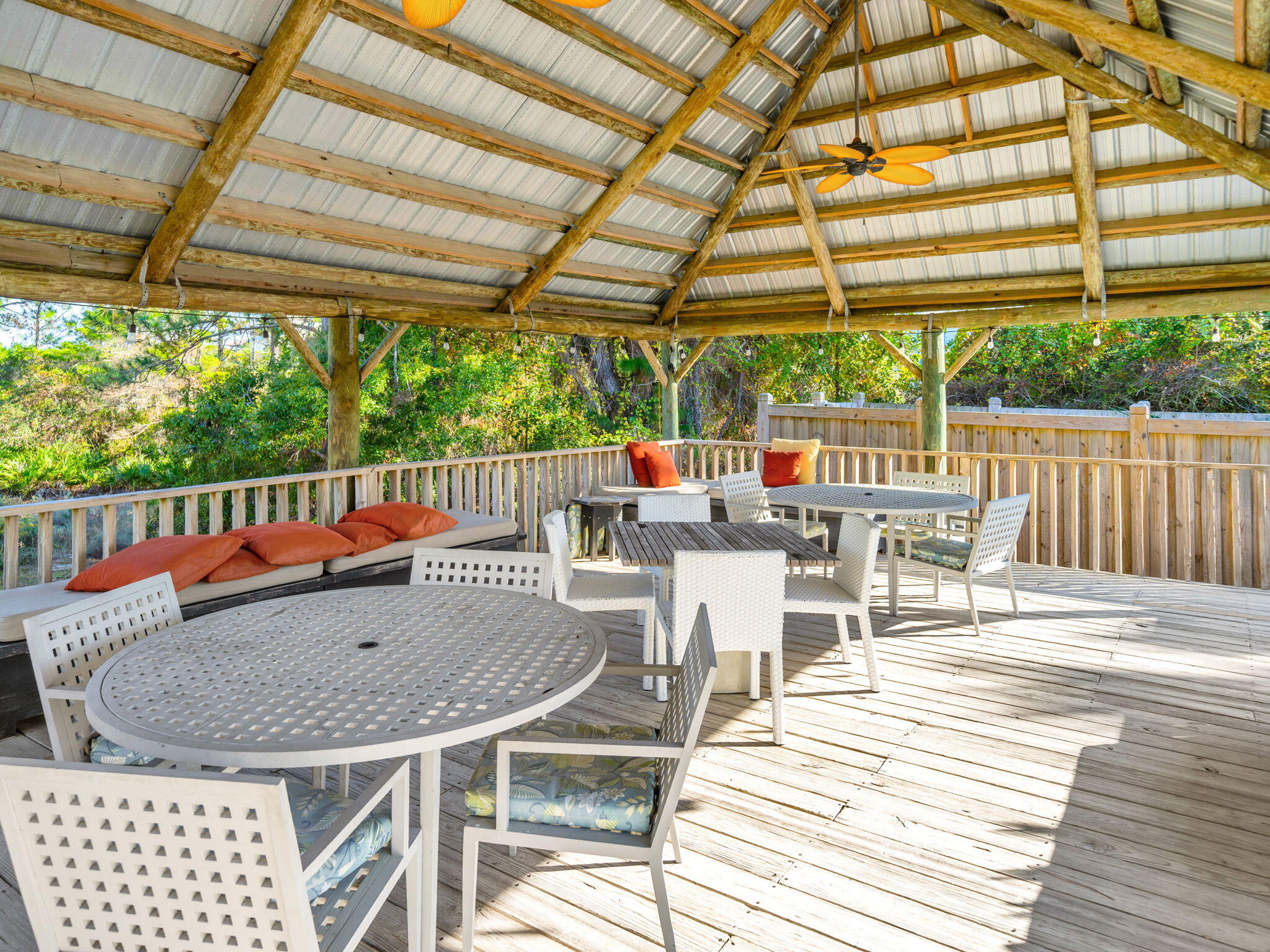 145 Beachfront Trail, Unit 307A Santa Rosa Beach, FL 32459 - Photo 42 of 60 a view of patio with table and chairs and wooden floor