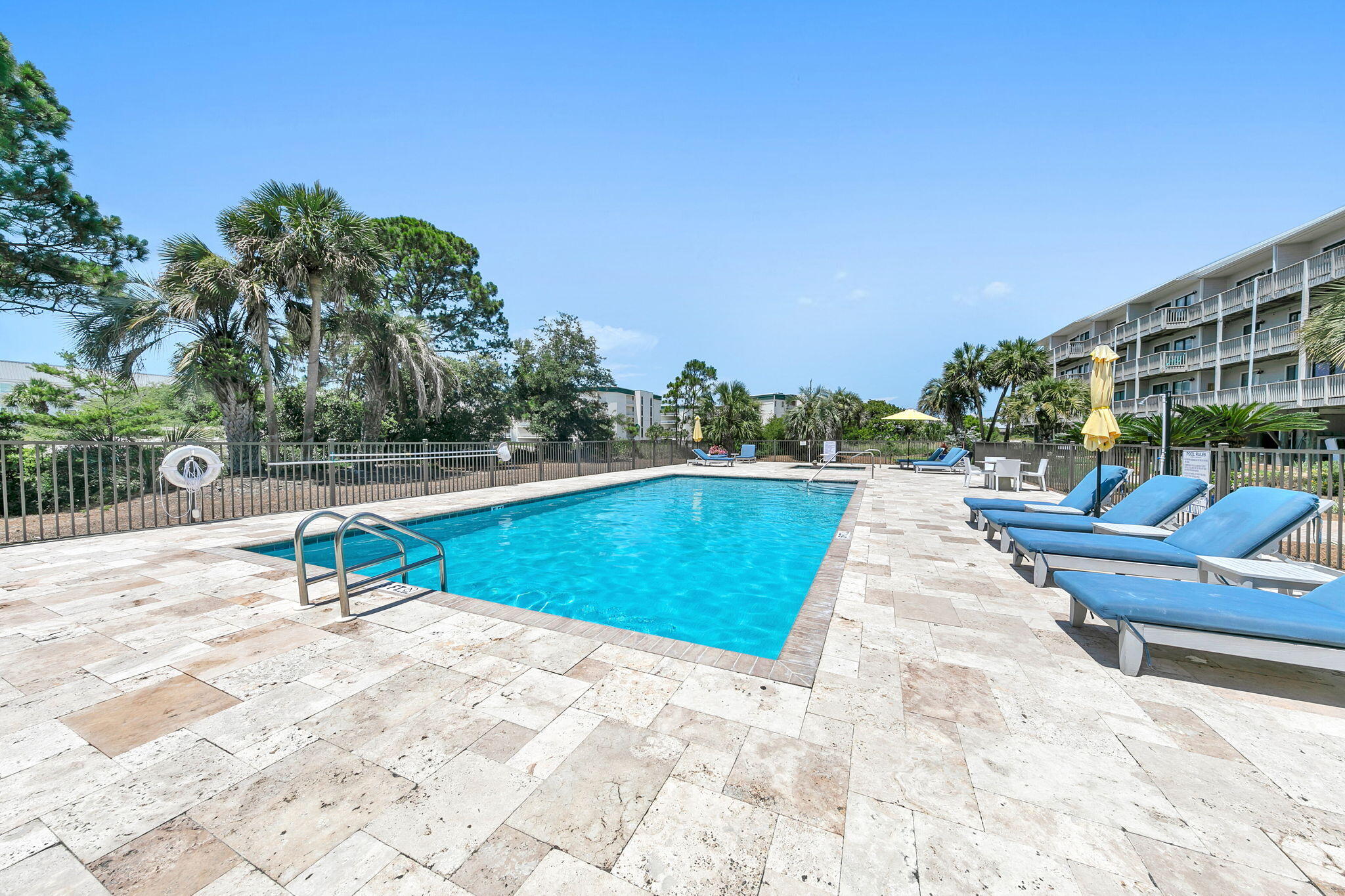 145 Beachfront Trail, Unit 307A Santa Rosa Beach, FL 32459 - Photo 44 of 60 a swimming pool with outdoor seating and deck