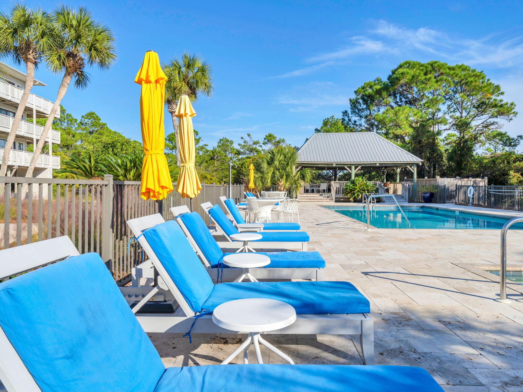 145 Beachfront Trail, Unit 307A Santa Rosa Beach, FL 32459 - Photo 46 of 60 a backyard of a house with table and chairs